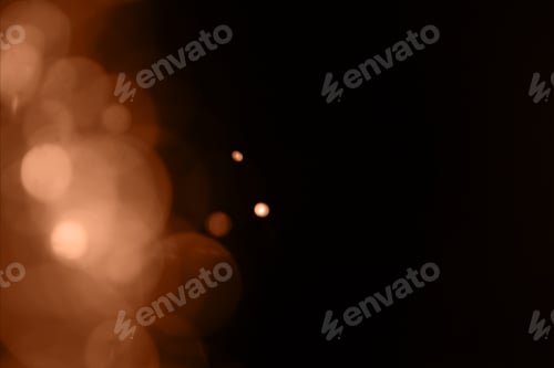 Preview: Blurry garland lights on a dark background. Image toned in color of the year 2024 - Peach Fuzz