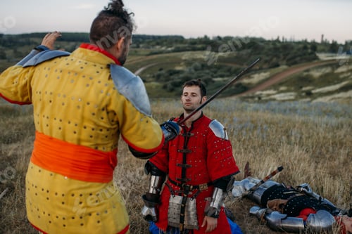 Preview: Medieval knight in armor prepares to cut off head