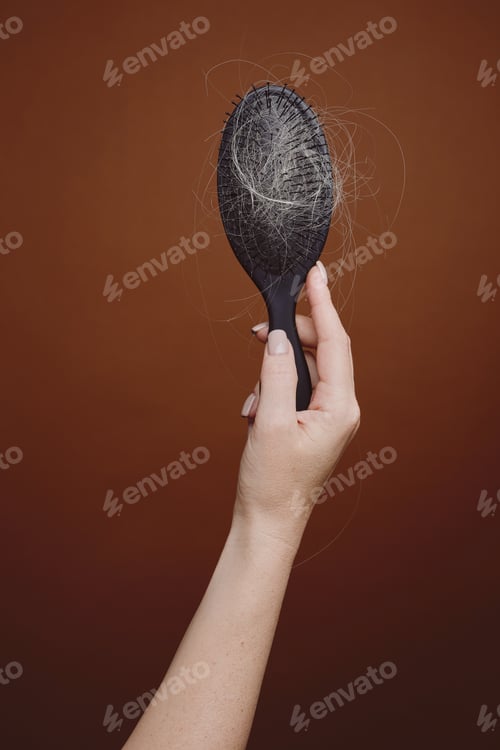 Preview: Female Hand Holding Hairbrush