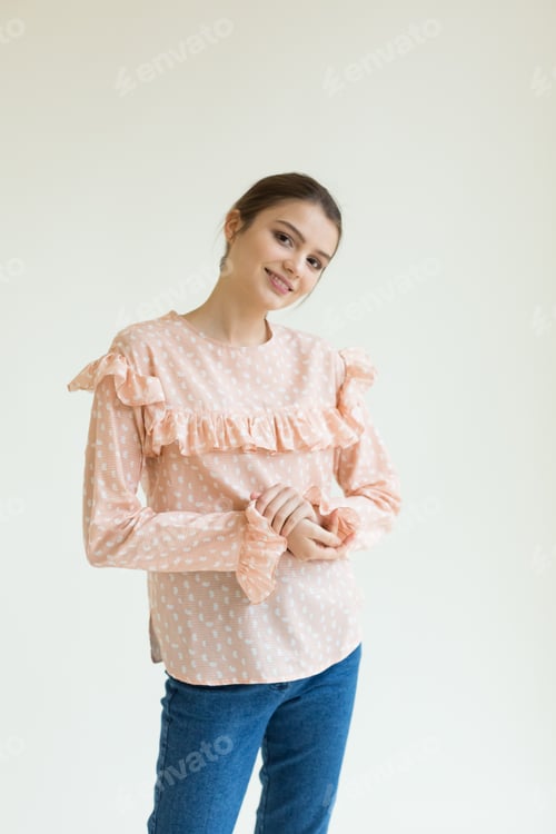 Preview: Young beautiful stylish woman in studio in coat, autumn fashion trend.