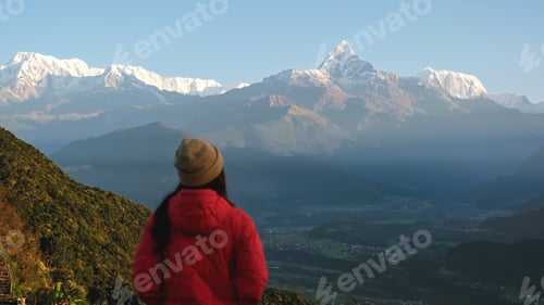 Preview: Woman traveler looking at Machapuchare peak, Annapurna mountain range in Pokhara , Nepal