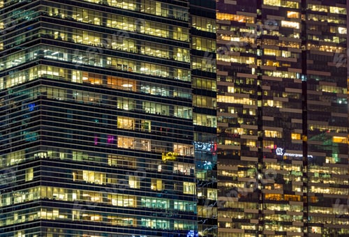Preview: Pattern of office buildings windows illuminated at night. Lighting with Glass architecture facade