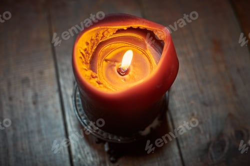 Preview: Big candle on wooden table