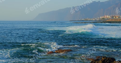 Preview: Big foaming waves. Coastline of ocean with cityscape, Los Gigantes