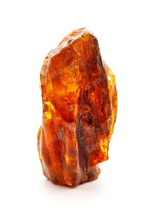 Preview: Natural amber. A piece of yellow opaque natural amber on white background