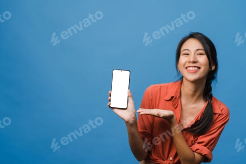 Preview: Cheerful Woman Displaying Phone with Blank Screen