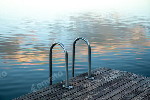 Preview: Swimming rails on the lake, wooden masonry by the river, landscape.