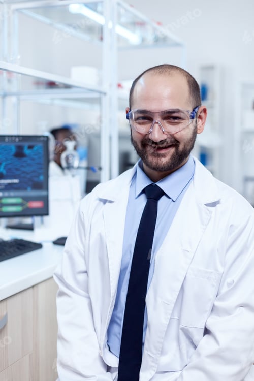 Preview: Young biochemistry scientist wearing protective glasses