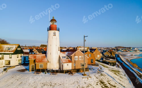 Preview: Urk lighthouse during winter with snow in the Netherlands