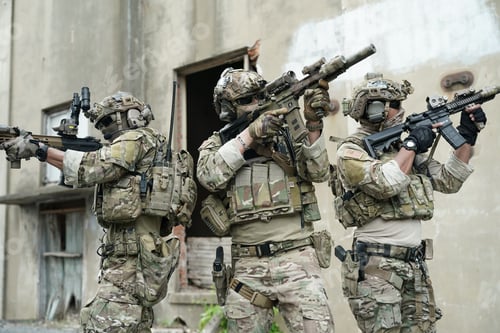Preview: Soldier in full US MARSOC armed with assault rifle run through the abandoned building. Military