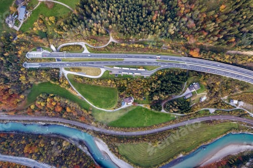 Preview: Top dawn aerial view of freeway speed road going out from undeground tunnel
