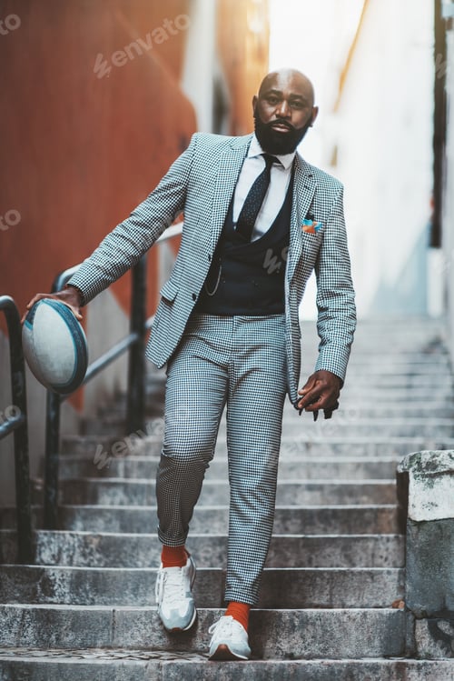 Preview: A black elegant guy with a football