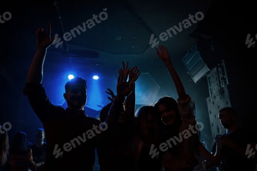 Preview: Group of people that enjoying dancing in the nightclub with beautiful lightings