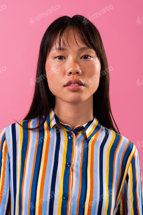 Preview: Beautiful asian woman portrait, young asian woman wearing colorful striped shirt portrait