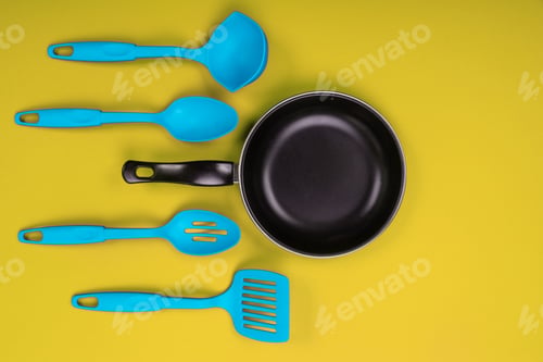 Preview: Kitchen utensils for cooking in kitchen isolated with copyspace on yellow background