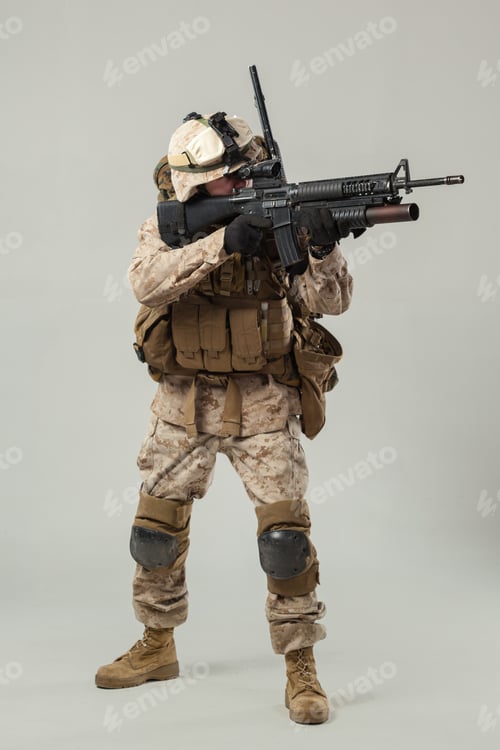 Preview: Soldier in combat gear holds rifle while preparing for action indoors during training session