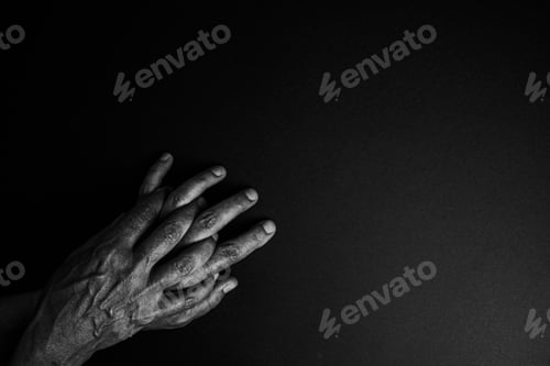 Preview: Old hands in black and white poking out from one corner