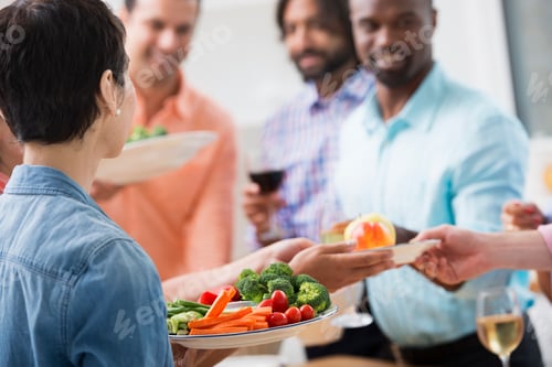 Preview: A working salad lunch for colleagues in open plan office in New York City.