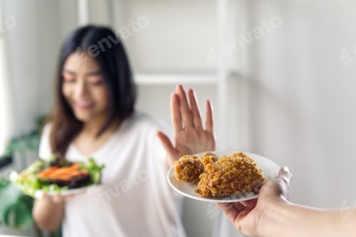 Preview: Young girl rejecting junk food or unhealthy food