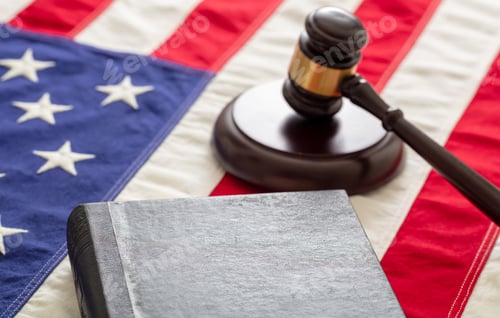 Preview: Law gavel and book on United States of America flag.