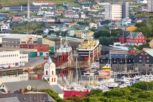Preview: Torshavn city town harbor in Feroe islands. Shipbuildings and church