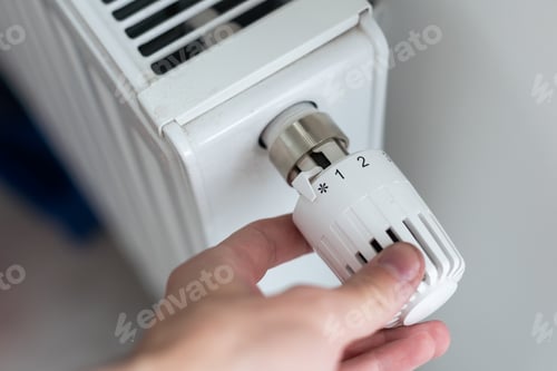 Preview: turning down thermostat on radiator to save energy due to heating cost price hike