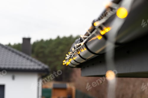 Preview: Installing LED lights along the gutter around the house, decorating the house for the holidays.