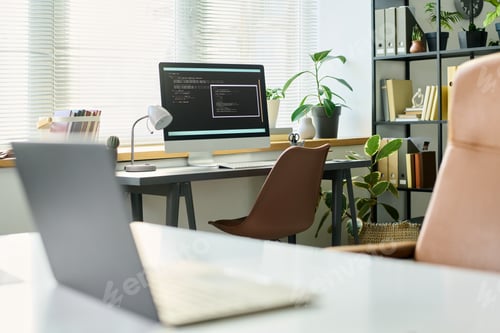 Preview: Modern Office Workspace Featuring Computer Developing Neural Network Code