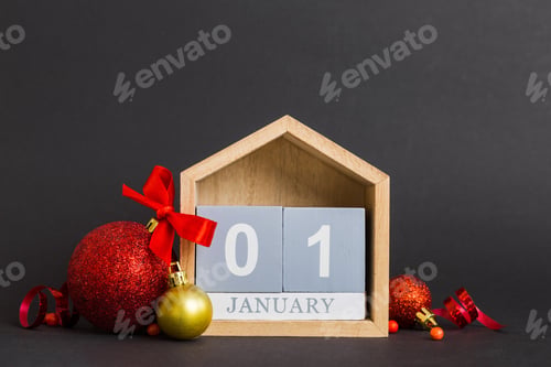 Preview: 1 january. Christmas composition on colored background with a wooden calendar