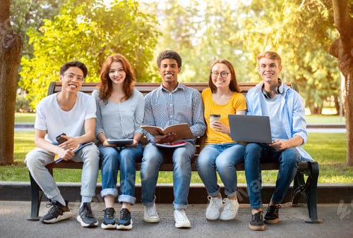 Preview: Smiling Students Relaxing Together Outdoors in a Park