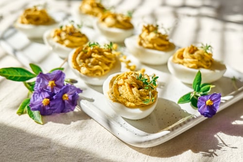 Preview: Stuffed easter eggs mimosa with egg yolk, turmeric, cream cheese and cress salad.