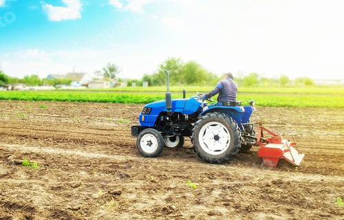 Preview: Farmer on a tractor cultivating the field