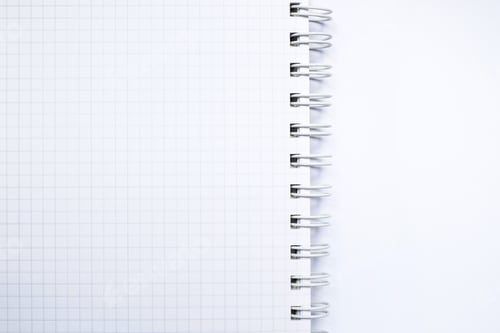Preview: Close up top view of white ring binder notebook