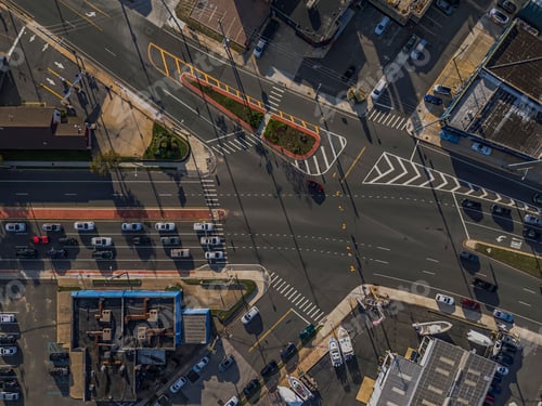 Preview: Aerial view of a busy urban intersection with vehicles.