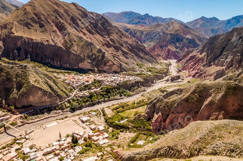 Preview: Scenic view of a village in a dry climate, nestled among mountains