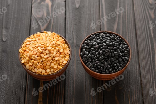 Preview: Fresh organic natural beans and peas on wooden rustic black background
