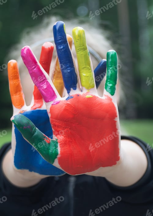 Preview: a child's hand painted in different colors symbolizes children's creativity