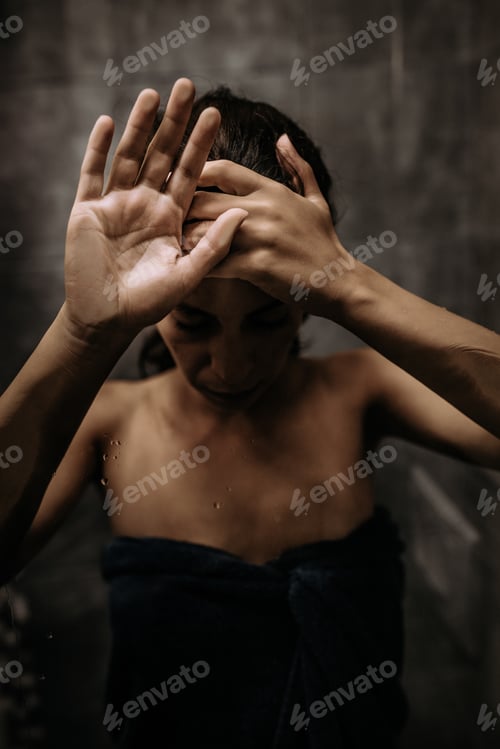 Preview: Adult woman, holding everything inside of her.