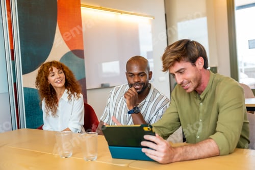 Preview: Diverse business colleagues collaborating in modern office during a meeting