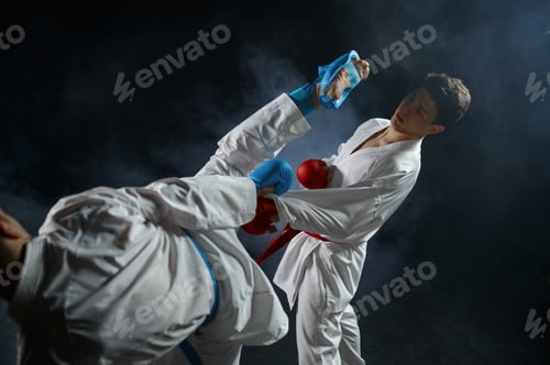 Preview: Two male karatekas in white kimono and gloves