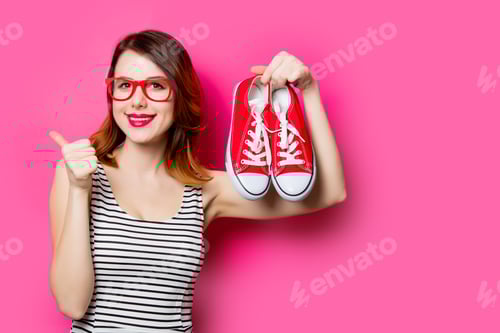 Preview: Cheerful Woman with Red Shoes and Striped Shirt