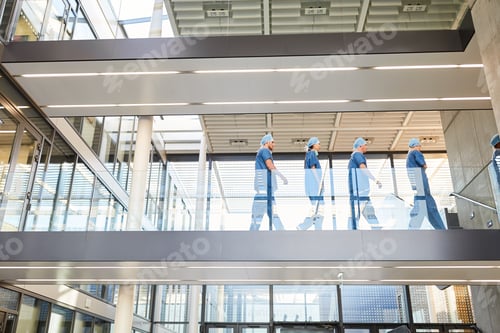 Preview: Group Of Surgeons In The Stairway Of The Clinic On The Way To Surgery
