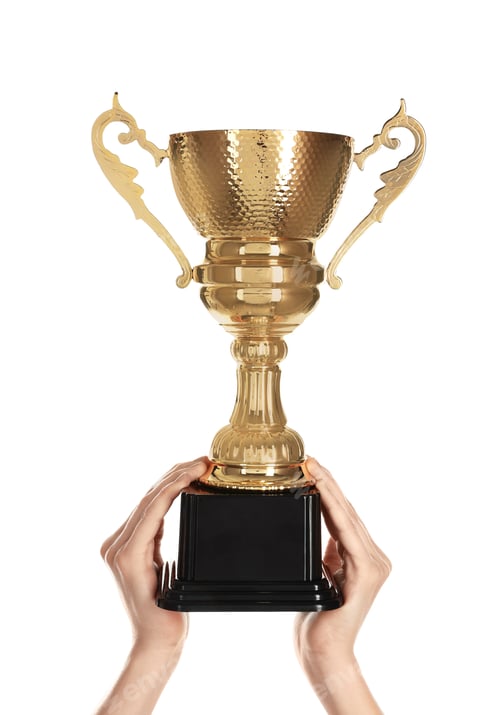 Preview: Young woman holding gold trophy cup on white background, closeup