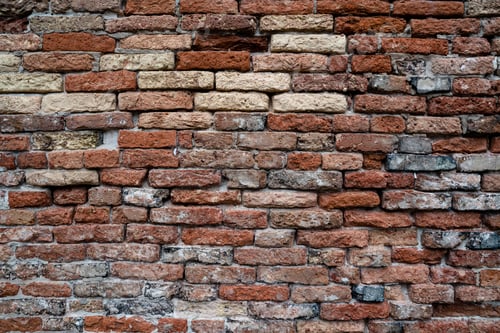 Preview: Rustic red brick wall with textured surfaces