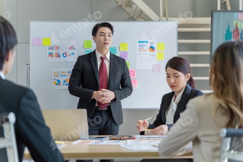 Preview: A group of young Asian businessmen Talking and planning work happily