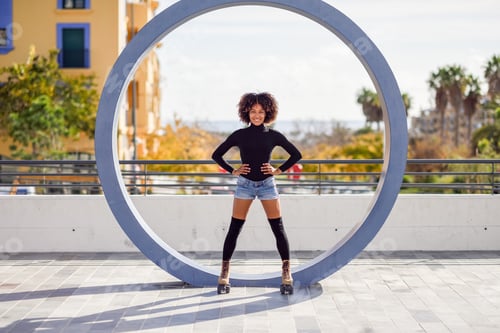 Preview: Black woman on roller skates riding outdoors on urban street