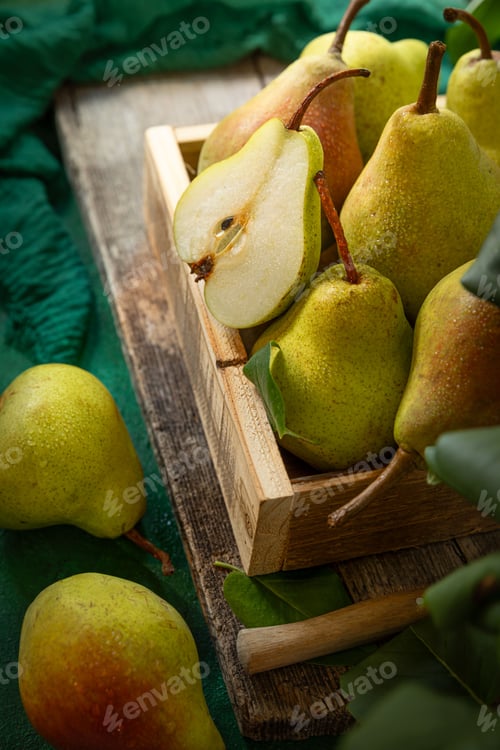 Preview: Fresh pears in a rustic wooden crate.