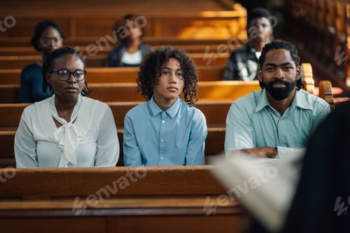Preview: Family sitting in church pew listening to sermon