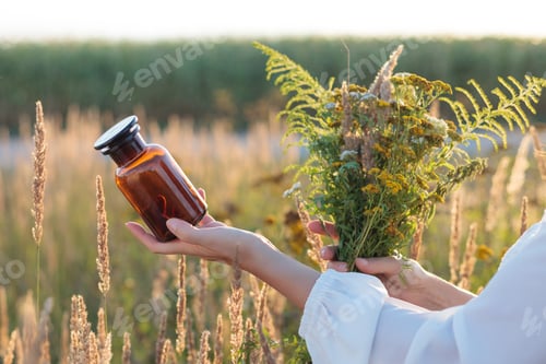Preview: A woman holding a pill dish. Alternative medicine, treatment with herbs. Space for text.