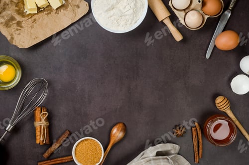 Preview: Ingredients for making dough dishes: cakes, cookies, muffins, pies on a dark background.